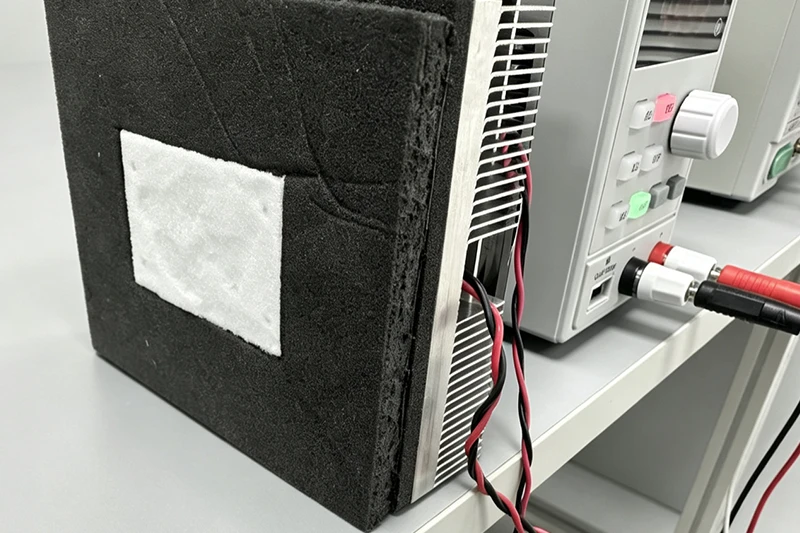 Foam insulated TEC box connected to temperature controller for testing